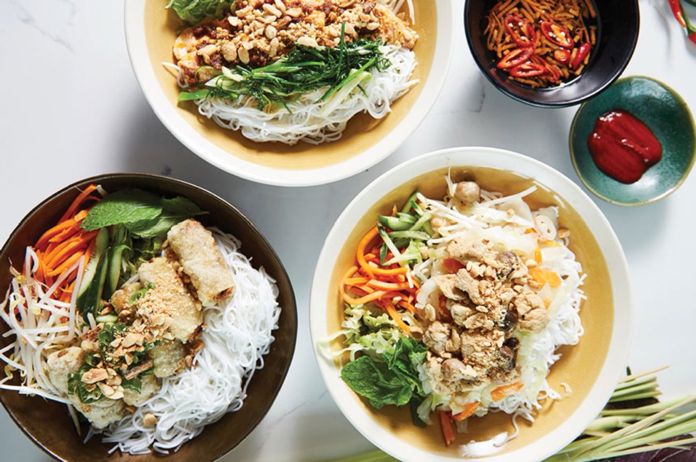 Three vermicelli noodle bowls seen from above