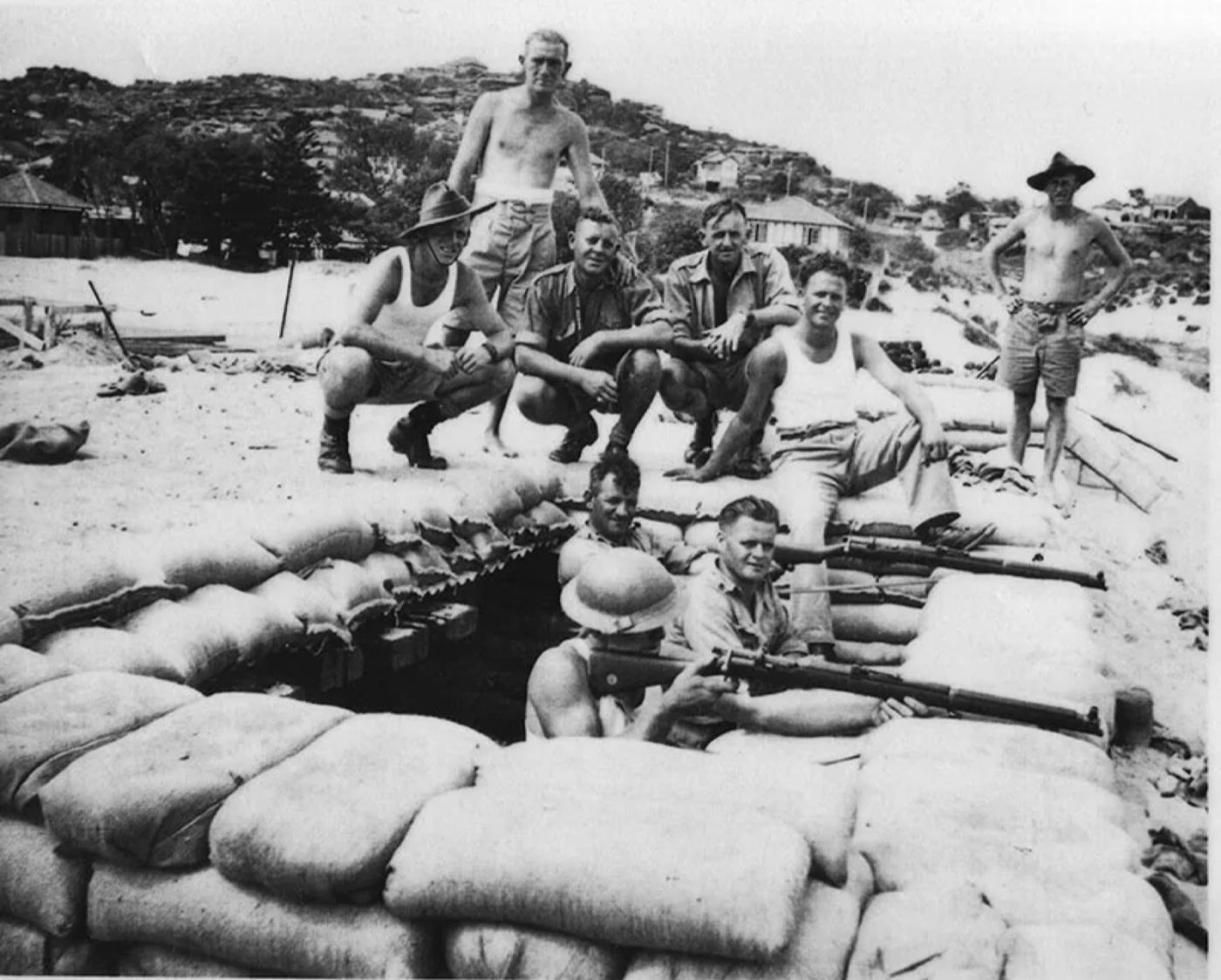 Diggers stacking sandbags on the beach in the 1930s