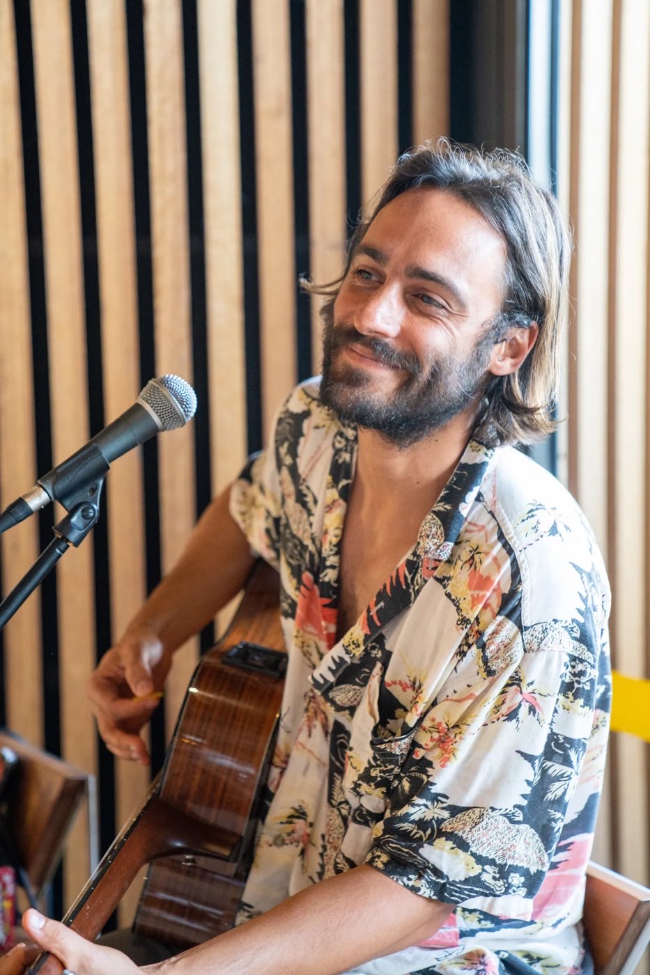 A musician playing guitar at Harbord Diggers