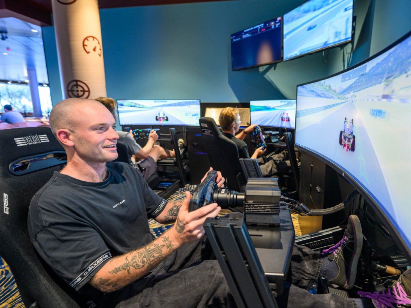 A man in a racing simulator rig